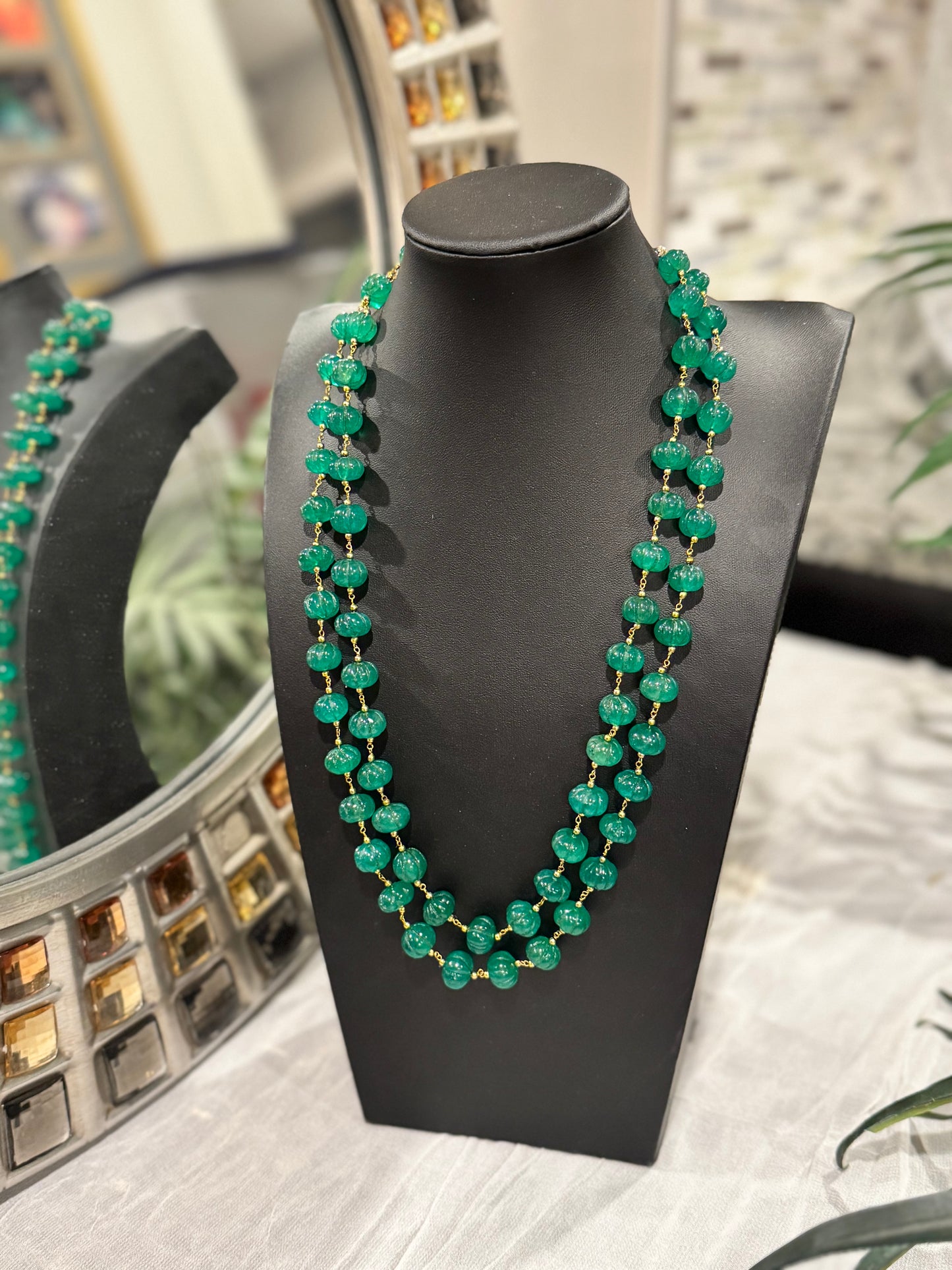 Emerald pumpkin carving in chain necklace