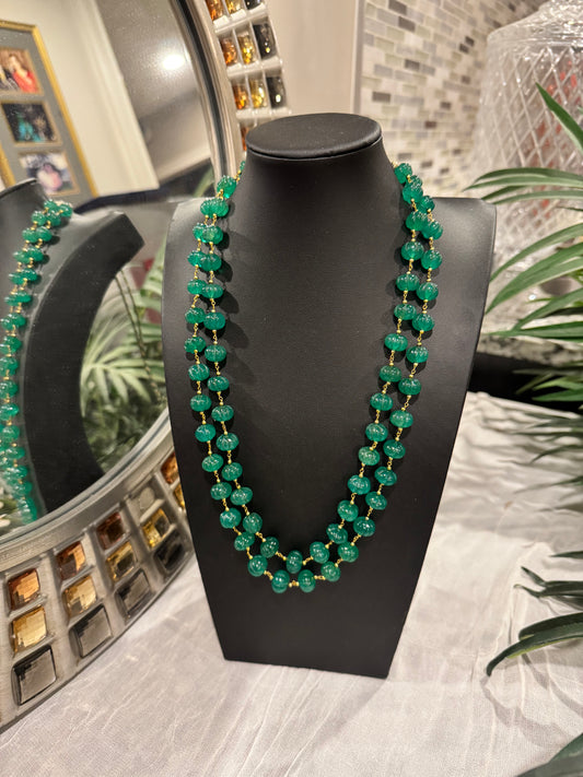 Emerald pumpkin carving in chain necklace
